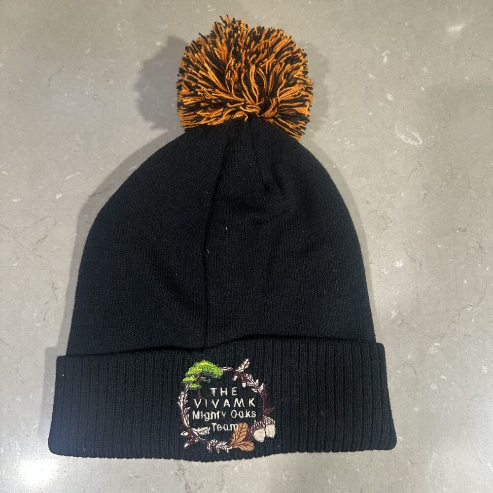 Black and Orange Hat with Bobble with Mighty Oaks Logo